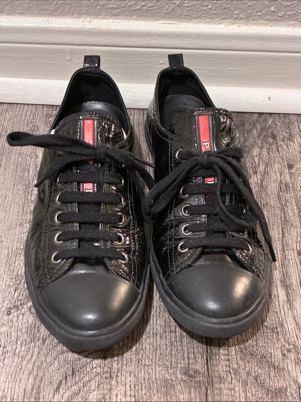 Prada Black Sneakers with Red Accent